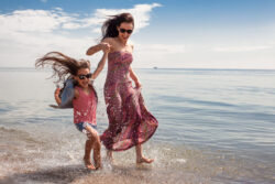 A mother enjoying the beach with her kids in st augustine